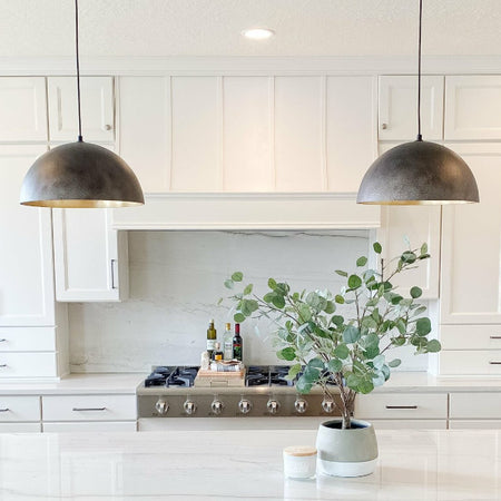 Modern white kitchen with island and pendant lights